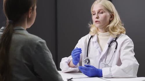 Doctor Consulting with Patient at Table
