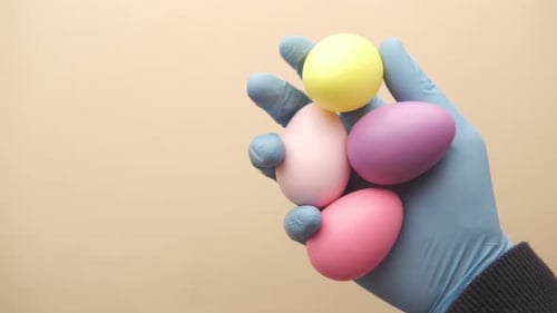 Easter Concept with Multi Color Egg on Hand