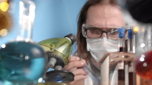 Researcher Examining Test Tube in Lab Close Up
