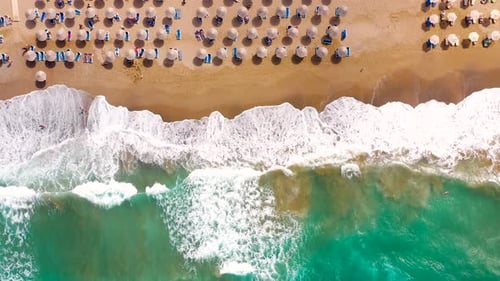 Aerial View of the Sea Sandy Beach Sun Umbrellas and Sunbeds Unrecognizable People