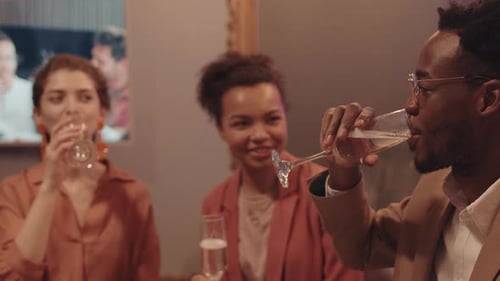 Friends Celebrating Together While Drinking Champagne