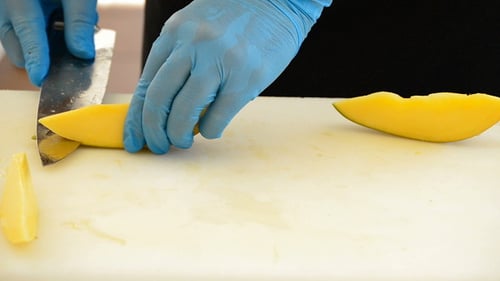 Slicing Fresh Mango on a Cutting Board