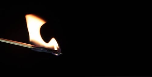 Match Being Lit and Burning in Macro Shot