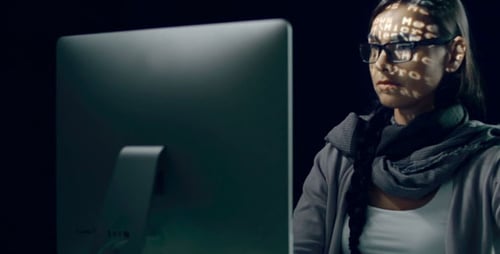 Woman Working on Computer at Night