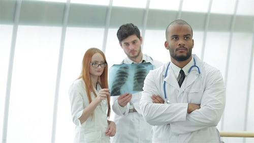 Medical Team Reviewing X-Ray in Hospital