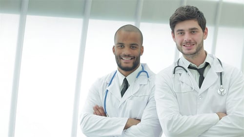 Doctors Reviewing X-Ray in Medical Office