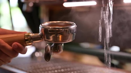 Portafilter boiling steam with coffee machine in coffee cafe, vintage filter image