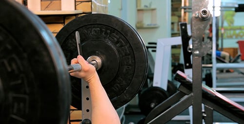Man Does Bench Press Barbell 2