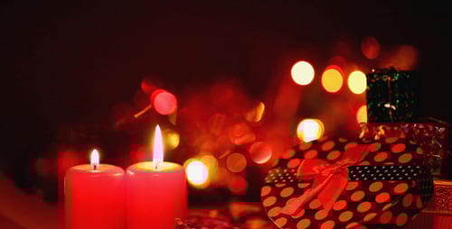 Festive Holiday Gifts and Candles Glowing
