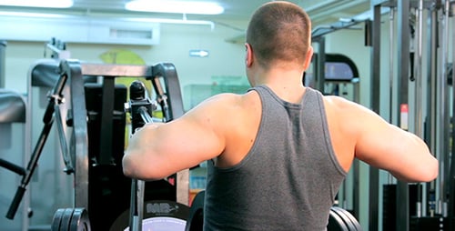 Man Doing Seated Row Exercise in Gym
