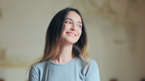 Smiling Woman Looking at Camera Indoors
