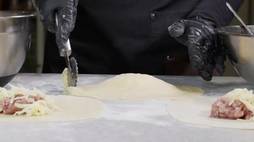 Closeup Shot of Hands in Black Gloves Bakery Chef Applying Flour on Dough Isolated Background