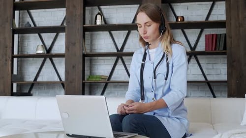 Woman Doctor Telehealth Meeting with Laptop at Home