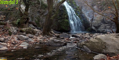 Scenic Waterfall Flowing into Tranquil Stream