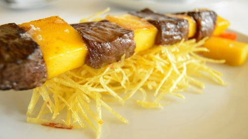 Delicious Beef and Mango Skewer on Fries