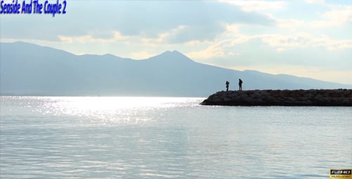 Scenic Ocean View with Silhouetted Figures