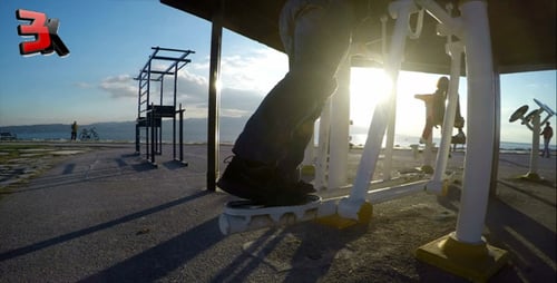 Person Exercising on Machine at Outdoor Gym