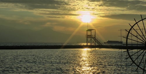 Ocean Sunrise with Boat Passing in Distance
