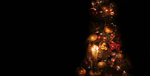 Christmas Tree Decorations with Candles on Dark Background