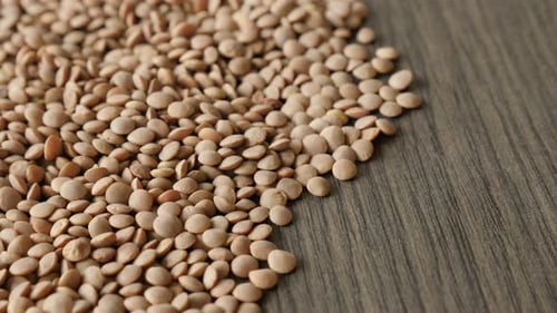 Close-up edible pulse of lentil heap 4K 2160p 30fps UltraHD tilting footage - Healthy Lens esculen