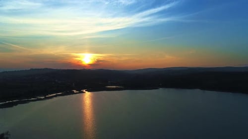 Picturesque Lake Reflecting Vivid Sunrise or Sunset