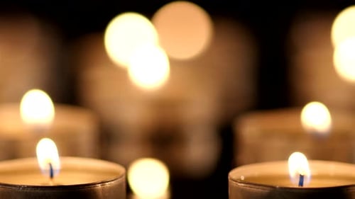 Close Up of Candles Glowing in the Dark