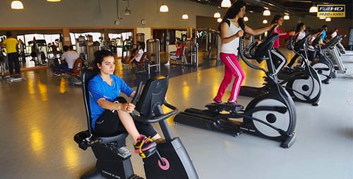 People Exercising in Modern Gym With Fitness Equipment