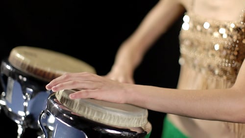 Young Woman Playing Conga Drums with Flair