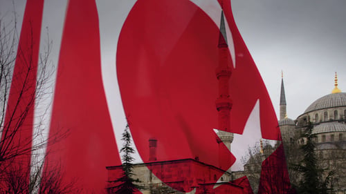 Turkish Flag Waving with Blue Mosque in Background