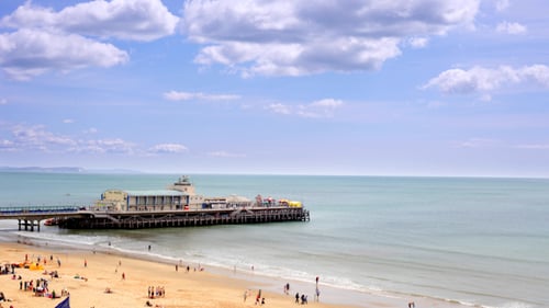 Scenic Beach and Pier on a Sunny Day