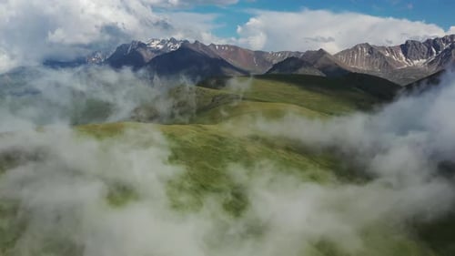 Aerial View of Green Mountain Hills and Clouds