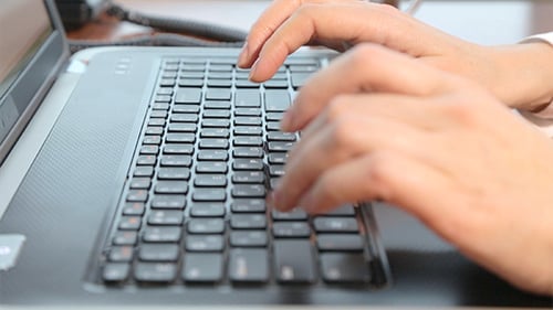 Close up of Hands Typing on Laptop Keyboard