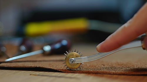 Hand Tracing Leather With a Spiked Wheel