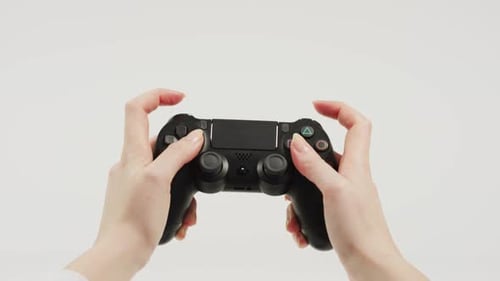 Hands Use Controller on White Background