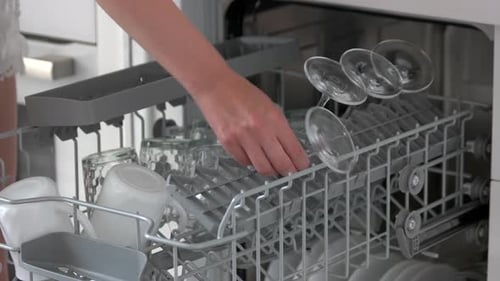 Loading Dishwasher with Glasses and Mugs