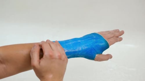 Washing a Blue Arm Cast with Soap