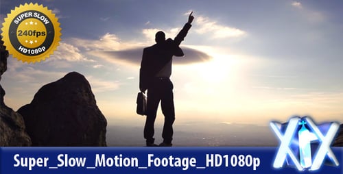 Businessman On Top Of A Mountain