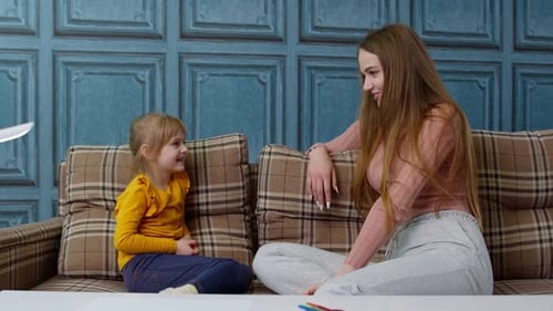 Woman Speaking with Blond Hair Young Girl at Home