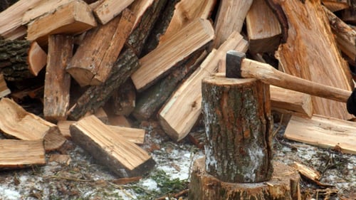 Lumberjack Chopping Wood In The Winter