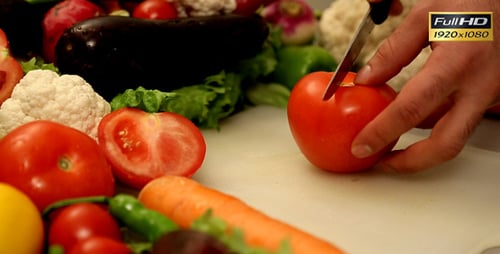 Man Preparing Fresh Tomato on Cutting Board