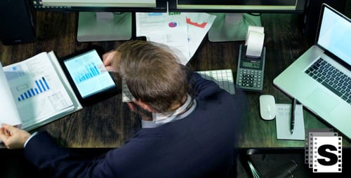Corporate Worker at Desk Analyzing Data