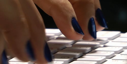 Typing Rapidly on White Computer Keyboard Close Up