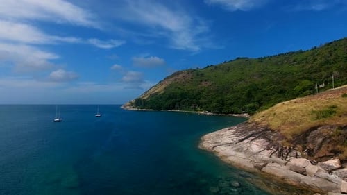 Copter Aerial View of Yacht Moored in a Bay Near Beach, Where People Are Swimming and Having Sunbath