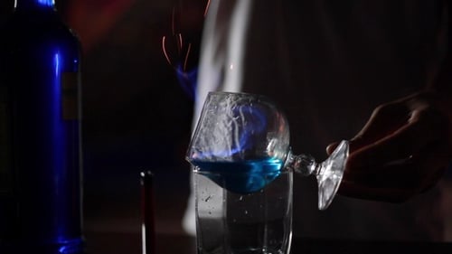 Flaming Cocktail in the Dark at a Bar
