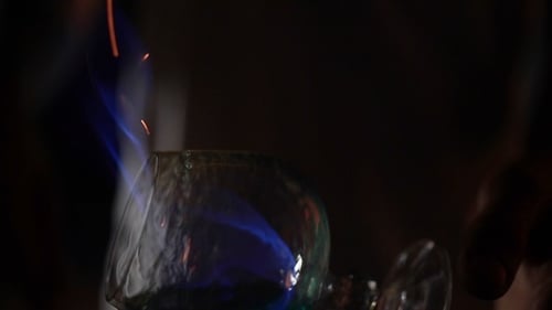 Cocktail Being Prepared with Flames on Top