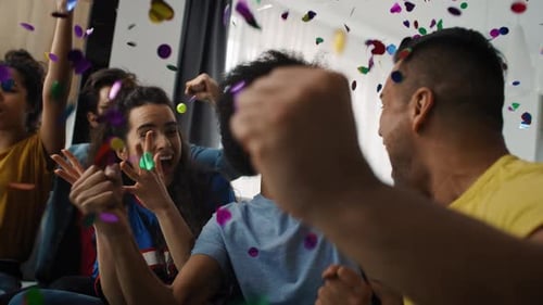 Friends Celebrating Victory with Confetti at Home