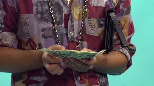 Man Holding Stack Of Money