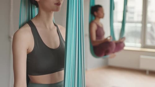 Woman Doing Aerial Yoga Position