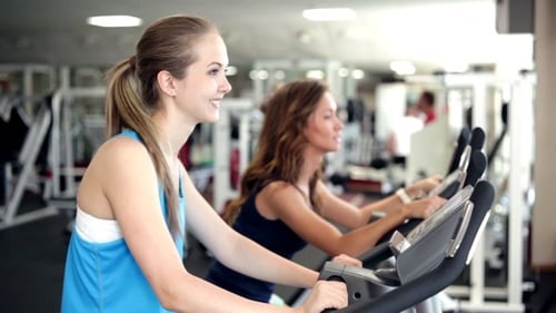 Woman Using Exercise Bikes
