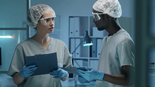 Medical Professionals Discussing Results in Laboratory Setting